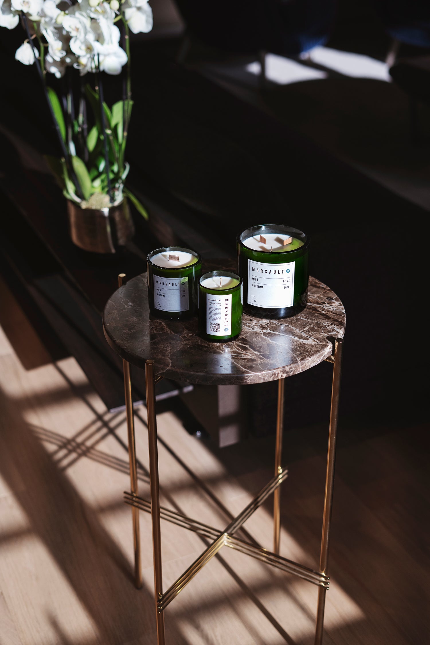 Gamme bougies de la marque Marsault Reims sur une table
